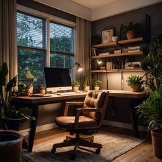 a home office with plants and a computer on a desk in front of a window