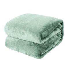 two blankets folded on top of each other in mint green color, one is rolled up and the other has a white background