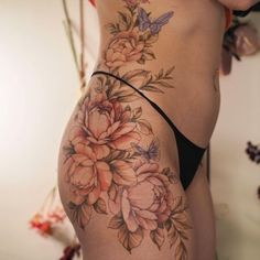 a woman's stomach with flowers on it