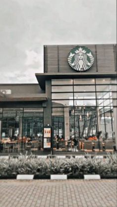 a starbucks coffee shop with the front door open