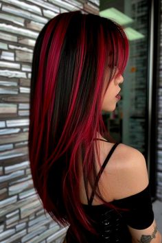 Check out the 45 gorgeous ideas of red highlights on black hair we just posted on our blog. From the bright magenta red highlights you see here to vibrant copper and ginger streaks, you'll find a ton of trendy hair color combos and highlighting techniques in our latest article. Click to see it now or save the pin for later! Red And Pink Highlights On Dark Hair, Black Hair Magenta Highlights, Black And Red Streaks Hair, Dark Hair With Hot Pink Highlights, Red Highlights In Brown Hair Wolfcut, Red And Dark Hair, Brown Hair With Bright Red Highlights, Skunk Highlights Red, Dark Red Chunky Highlights