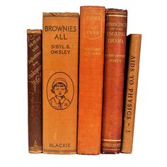 three old books sitting on top of each other in front of a white background with the title brownies all