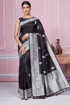 Shop black Banarasi sari online in USA with silver zari border. Look your best on festive occasions in latest designer sarees, pure silk saris, Kanchipuram silk sarees, handwoven sarees, tussar silk saris, embroidered sarees from Pure Elegance Indian fashion store in USA.-full view Black Pre-draped Saree With Zari Weaving For Puja, Black Art Silk Pre-draped Saree With Zari Weaving, Black Zari Weaving Saree For Diwali, Festive Black Saree With Zari Weaving, Black Handloom Banarasi Silk Traditional Wear, Black Banarasi Silk Traditional Wear With Handloom Detail, Black Banarasi Silk Traditional Wear Handloom, Black Art Silk Pre-draped Saree For Puja, Black Art Silk Saree