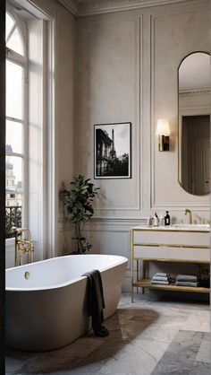 a bathroom with a bathtub, sink and large mirror in the middle of it