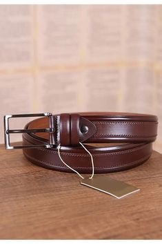 Introducing the epitome of luxury and refinement: our Cognac Dressing Belt for Men. This exquisite accessory is meticulously crafted from genuine leather, offering not only unparalleled durability but also a touch of elegance that elevates any ensemble. Designed for the modern gentleman, this belt seamlessly transitions from the boardroom to social gatherings, making it a versatile addition to any wardrobe. The belt's rich cognac hue exudes warmth and sophistication, making it an ideal companion Luxury Cognac Belt For Formal Occasions, Luxury Brown Belt For Formal Occasions, Brown Luxury Formal Belt, Elegant Brown Belt For Formal Occasions, Elegant Brown Formal Belt, Formal Brown Belts, Brown Leather Belt For Semi-formal Occasions, Formal Brown Belt With Smooth Grain, Luxury Brown Belt For Business