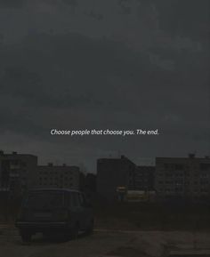 a car is parked in front of some buildings with the words choose people that choose you, the end