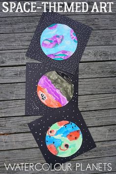 space themed art project for kids to make with watercolor paints and paper plates on the table