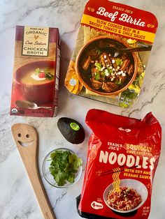 ingredients for soup laid out on a marble counter top