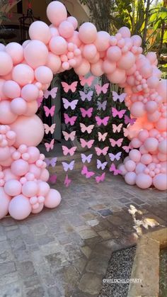 a bunch of balloons that are in the shape of butterflies