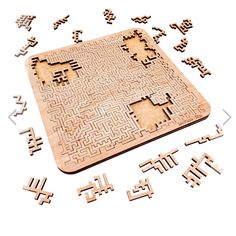 a wooden maze board surrounded by letters and numbers