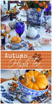 an autumn table setting with blue and white dishes, pumpkins and other fall decorations