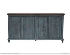 an old blue cabinet with three doors