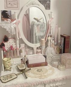 there is a vanity with many items on the table and in front of it, a mirror