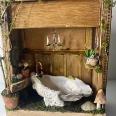 an old fashioned bathtub with moss growing on the sides and hanging from it's side