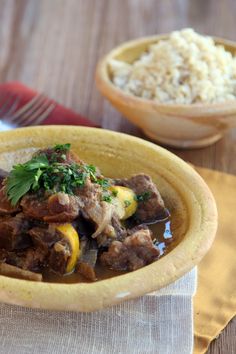 a yellow bowl filled with meat and vegetables