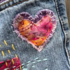 a patchwork heart on the back of a pair of jeans