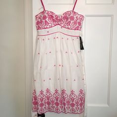 Nwt City Triangles Sundress, Size 7/8. White Cotton With Hot Pink Embroidery. Spaghetti Straps, Empire Waist And Sweetheart-Style Neckline. Ties In The Back. 100% Cotton With Polyester Lining. Hot Pink Embroidery, Fitted White Embroidered Dress, White Embroidered Dress For Spring, White Floral Embroidered Sundress For Spring, White Floral Embroidery Sundress For Spring, White Sleeveless Embroidered Dress With Lace Trim, White Embroidered Sleeveless Dress With Lace Trim, Fitted White Embroidered Dress For Vacation, White Embroidered Fitted Sundress