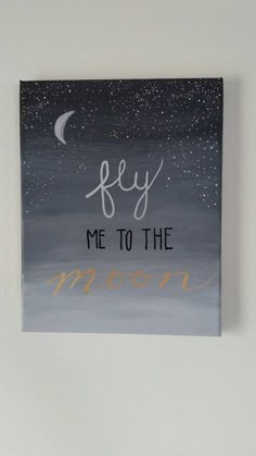 a painting with the words fly me to the moon written in gold lettering on it