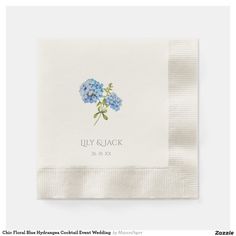 a napkin with blue flowers on it and the words lily quack written in white