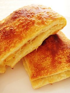 two pieces of bread sitting on top of a white plate