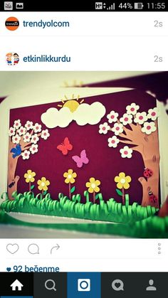 a cake with flowers and trees on it is shown in the middle of an instagram page