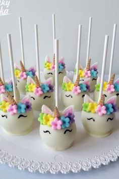 there are many little unicorn cake pops on the plate