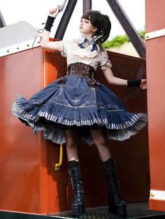 Step into a world of Victorian elegance and steampunk adventure with this meticulously crafted Steampunk Lolita set. The ensemble features an Apricot Ruffle Neckline Shirt, a Brown Corset Belt, and a Blue Skirt, each piece designed to blend seamlessly for a cohesive and striking look.  Shirt   	 		 			Size 			S 			M 			L 		 		 			Full Length 			51 			53 			55 		 		 			Bust 			88 			92 			96 		 		 			Shoulders 			31 			32 			33 		 		 			Sleeve Length 			24 			28 			29 		 		 			Cuff 			27 			28 			29 		 	     Skirt   	 		 			Size 			S 			M 			L 		 		 			Full Length 			67 			69 			71 		 		 			Waist 			66-76 			70-80 			74-84 		 	     Corset Belt   	 		 			Size 			S 			M 			L 		 		 			Waist 			66-76 			70-80 			74-84 Steampunk Halloween Costume Skirt, Steampunk Costume Skirt With Attached Cancan, Steampunk Skirt For Alternative Fashion, Steampunk Ruffle Skirt For Halloween, Steampunk Ruffled Skirt For Halloween, Vintage Fitted Skirt For Cosplay, Vintage Skirt With Attached Cancan For Costume, Victorian Steampunk Fashion, Ouji Fashion