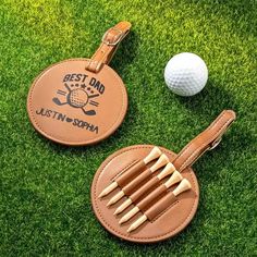 two leather golf tags with the words best dad and just - in - son on them