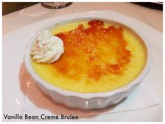 a white bowl filled with food on top of a table