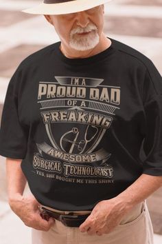 an older man wearing a t - shirt that says i'm a proud dad