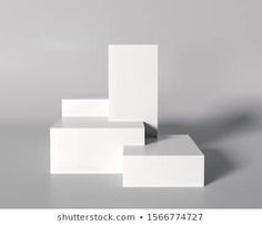 an abstract photo of white blocks on a gray background with room for text or image