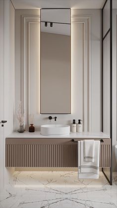 a bathroom with marble counter tops and white walls