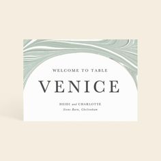 a welcome card with the words venice in black and white, on an off - white background