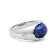 The Silver Oval Signet Ring with Blue Lapis by Nialaya is a luxurious fusion of elegance and sophistication. With its polished blue lapis gemstone set in sophisticated silver, it exudes timeless style and refinement. Whether worn for special occasions or as a daily accessory, this ring is sure to make a statement and become a cherished heirloom. Ring in Stainless Steel Blue Lapis Stone Modern Sapphire Ring Oval Cabochon Polished Finish, Modern Sapphire Ring With Oval Cabochon And Polished Finish, Luxury Blue Ring With Oval Cabochon, Luxury Tanzanite Jewelry With Polished Finish, Luxury Blue Oval Cabochon Ring, Formal Lapis Lazuli Ring Jewelry, Modern Oval Cabochon Sapphire Ring, Modern Sapphire Ring With Oval Cabochon, Luxury Signet Ring With Oval Cabochon Gemstone