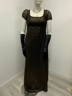 Beautiful black and gold lace dress made with polyester lining .. perfect for a regency ball or tea party very elegant..Please not it takes me 5-8 business days to produce and ship your dress after order is placed . THERE IS NO RETURNS OR EXCHANGES ACCEPTED  PLEASE BE SURE TO CHECK THE MEASUREMENTS ON THE BOTTOM OF THE DESCRIPTION. If for any reason the measurements don't  match with yours be sure to provide to me at the time of order. PLEASE NOTE COLOR MAY BE A LITTLE DIFFERENT ONCE YOU SEE IT, If measurements are not provided at the time of purchase we will send the dress with the measurements provided here on the listing PLEASE ADVISE OF THAT SMALL / BUST / Length                  32-34.     44 MED   /    36-38 /  46 LARGE /. 40-42/ under bust 38 and length 47" The small dress is made w Elegant Victorian Dress With Lace Trim, Elegant Victorian Dress With Lace Trim For Evening, Elegant Victorian Evening Dress With Lace Trim, Elegant Evening Dress With Lace Sleeves For Formal Occasions, Formal Evening Dress With Lace Sleeves, Elegant Formal Evening Dress With Lace Sleeves, Fitted Empire Waist Evening Dress, Elegant Victorian Dress With Lace And Historical Design, Regency Style Lace Formal Dress