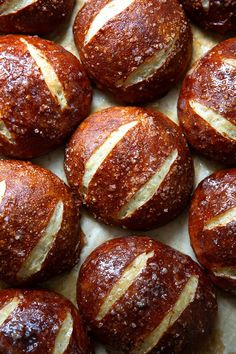 freshly baked hot cross buns on parchment paper