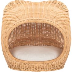 a wicker dog bed with a white pillow on the bottom and back side, in front of a white background