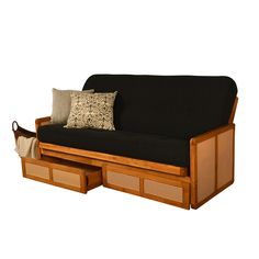 a couch with two drawers underneath it and a pillow on the bottom shelf next to it