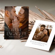 an image of a couple kissing on the cover of their engagement album, which has been printed out