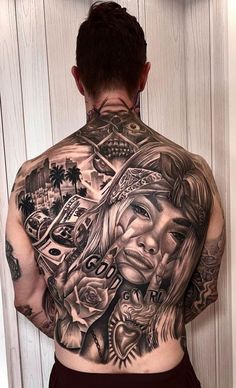 the back of a man's body with tattoos on it