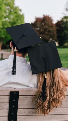 a person sitting on a bench wearing a graduation cap and gown with long blonde hair