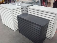 several white and black tables sitting next to each other