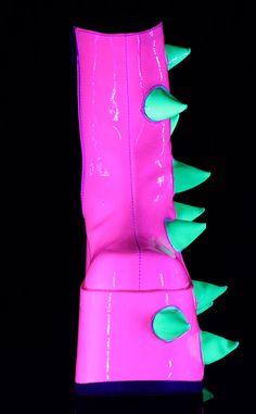 Slay the night away! The SLAY-77 ankle boots are covered in spikes to keep you looking tall and dangerous. Vegan UV reactive pink & green upper 7-inch platform Side zip Ankle length Puff spike details U.S women's sizing-refer to size chart for more info Green Platform Boots, Emo Boots, Kidcore Clothing, White Platforms, Demonia Boots, Concert Wear, Green Platform, Demonia Shoes, Punk Aesthetic