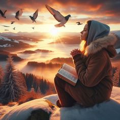 a woman sitting on top of a snow covered hill next to birds flying over her