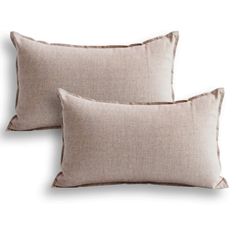 two linen pillows on white background