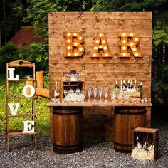 an outdoor bar set up with wine glasses