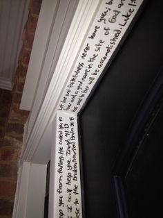 a close up of a door with writing on the front and back side of it