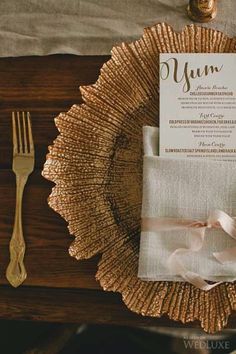 a place setting with napkins, fork and knife