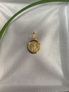 Material: 14kt solid Inches: 0.40 Hand make 14k Gold Miraculous Medal As A Gift, 14k Gold Miraculous Medal As Gift, 14k Gold Spiritual Miraculous Medal Jewelry, 14k Gold Spiritual Miraculous Medal Jewelry And Charms, 14k Gold Miraculous Medal Jewelry In Gold, 14k Gold Jewelry With Miraculous Medal, Yellow Gold Miraculous Medal As Gift, 14k Gold Miraculous Medal Pendant, 14k Gold Miraculous Medal Jewelry