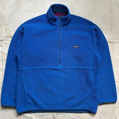 INTERNATIONAL SHIPPING AVAILABLE This is a killer 2007 Patagonia Synchilla Fleece Pull Over in royal blue. This is in great used condition with average fleece wear. This is labeled a Mens Large and seems to fit true to size but please refer to all pictures and measurements before buying since all sales are final.  All measurements taken while laying flat. 24.5 inches from armpit to armpit. 28 inches from lower collar seam in back of neck to bottom of back. 24 inch sleeves. 20.5 inch shoulders. Since all sales are final, I am happy to answer any questions you may have to ensure you know exactly what you are getting. International Shipping Disclaimer: All International shipments are at the buyers own risk. Once the package leaves the USA, all I can do is view the same tracking that you see a Casual Blue Fleece Jacket For Outdoor Activities, Midweight Blue Fleece Jacket For Winter, Casual Midweight Blue Fleece Jacket, Blue Fleece Outerwear With Fleece Lining, Blue Fleece Jacket With Pockets For Sports, Blue Long Sleeve Fleece Jacket, Functional Blue Fleece Jacket With Pockets, Blue Patagonia Pullover, Functional Blue Long Sleeve Fleece Jacket